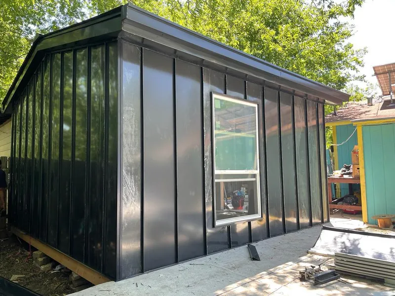 Black standing seam metal wall panels for Roof Inspection in Las Flores